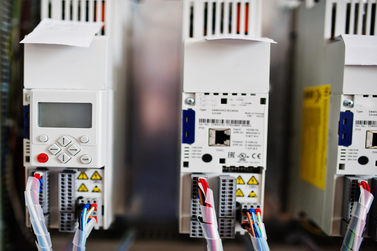 Close-up of an HVAC control system showcasing connected wiring and automation components, highlighting the need for strong cybersecurity measures.